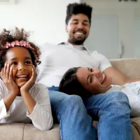 family-on-couch-laughing