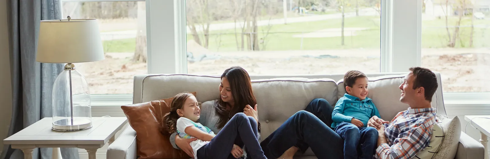 Family relaxing on a couch in Beaumont